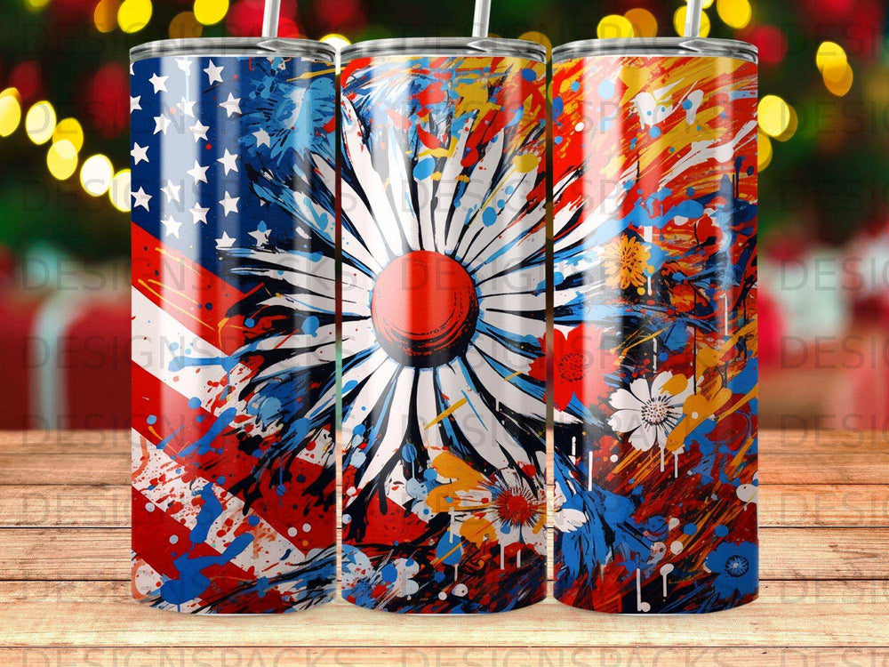 Three tumblers with a patriotic floral splatter design and abstract fireworks.