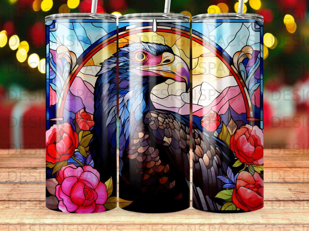 Stained glass bird with roses and mountains design on tumbler.