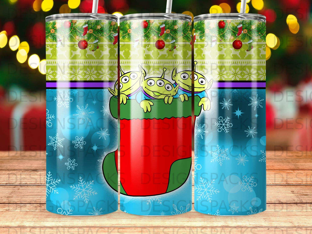 Three aliens from Toy Story peeking out of a festive Christmas stocking.