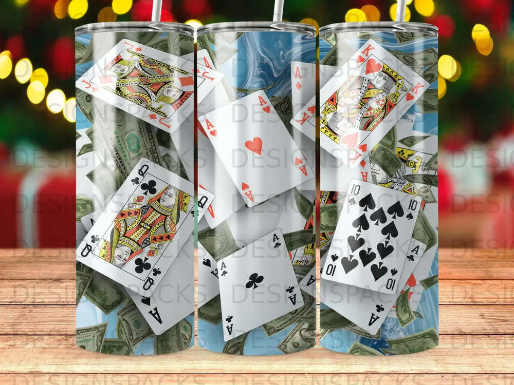 Playing cards and dollar bills scattered across a tumbler.