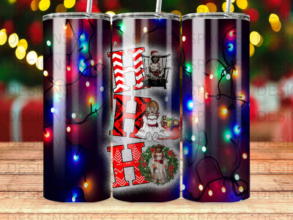 Christmas tumbler with "Ho Ho Ho" and doll design, bokeh lights background.