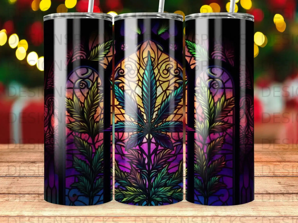 Stained glass design with marijuana leaf pattern on three tumblers.