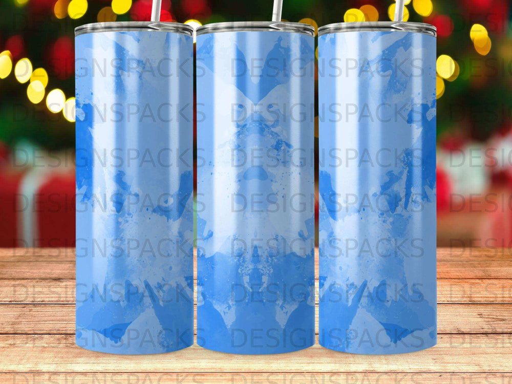 Three blue watercolor tumblers with straw on a blurred background.