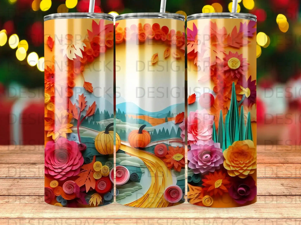 Three tall tumblers featuring a colorful autumn landscape with paper flowers and pumpkins.