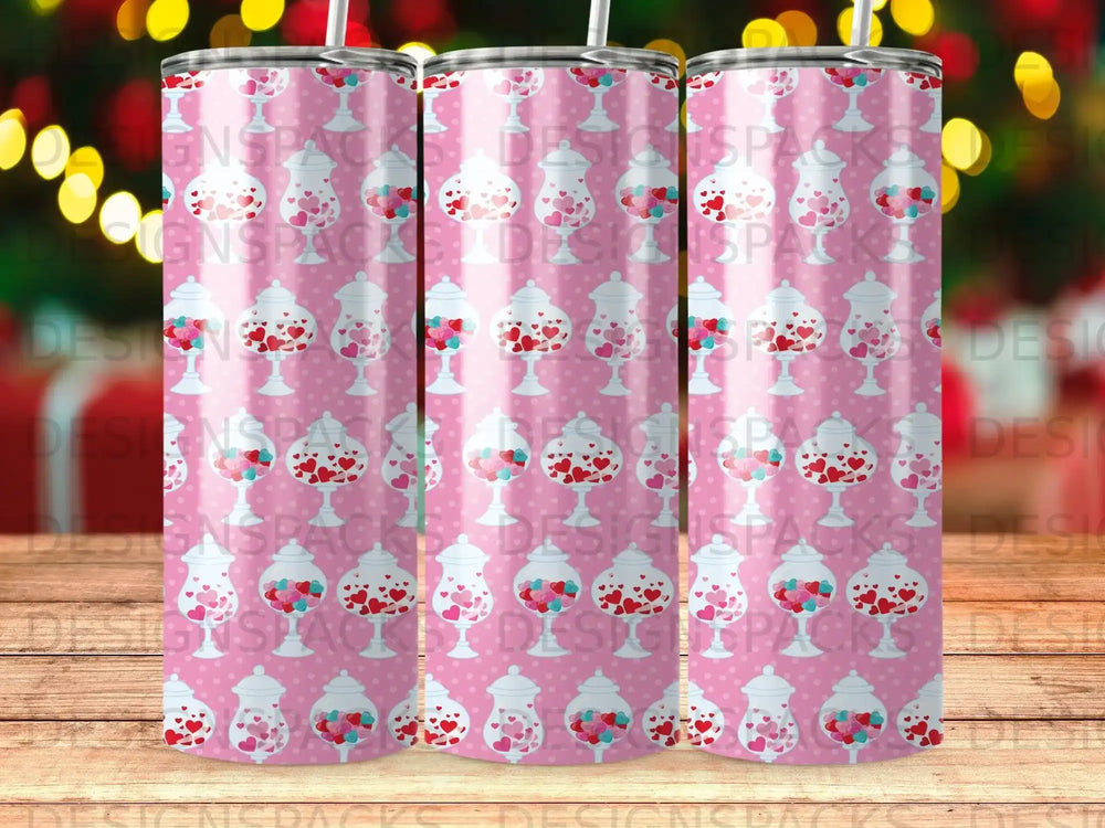 Pink patterned tumbler with heart-shaped candies in jars.