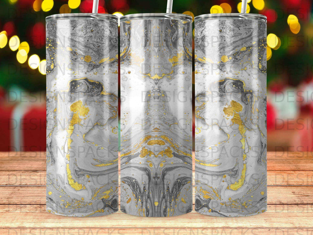 Three tumblers with a gray and gold marbled design, two visible straws.
