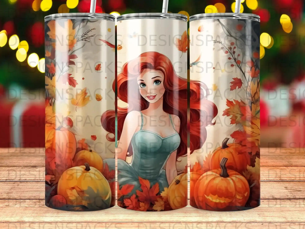 Tumbler with a cartoon woman and pumpkins, surrounded by autumn leaves.