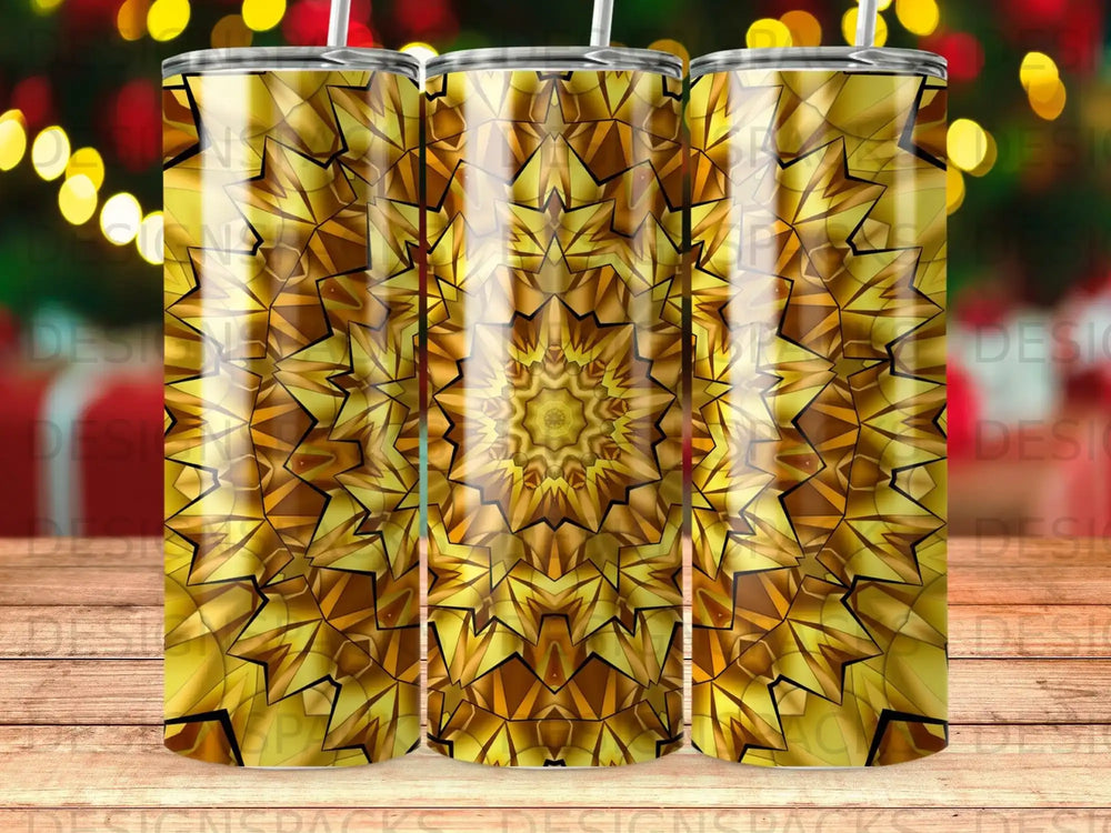 Gold geometric starburst pattern on three tumblers with bokeh lights background.