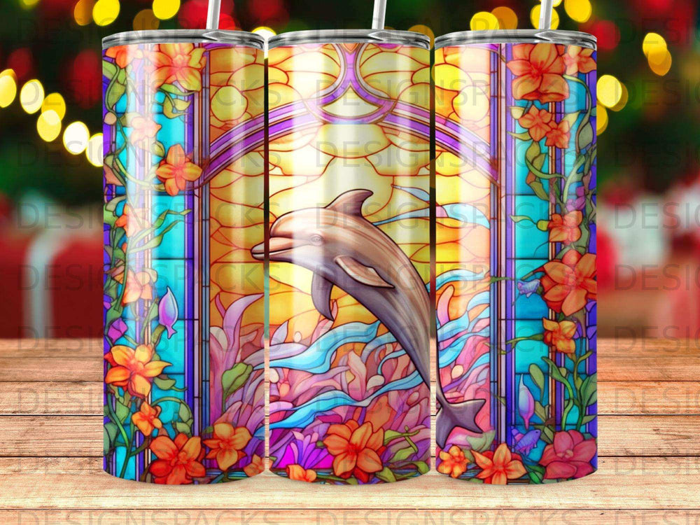 Stained glass tumbler with dolphin, floral, and wave design.