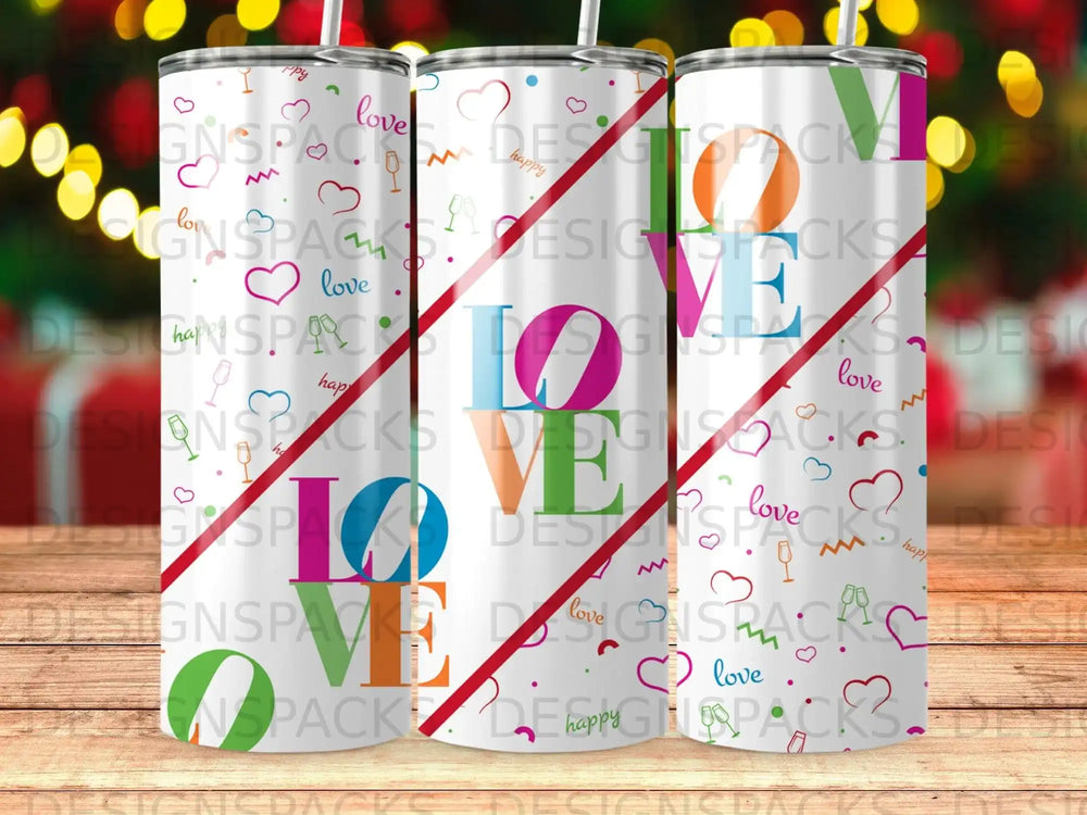 White tumbler with "love" in colorful letters and diagonal stripes.