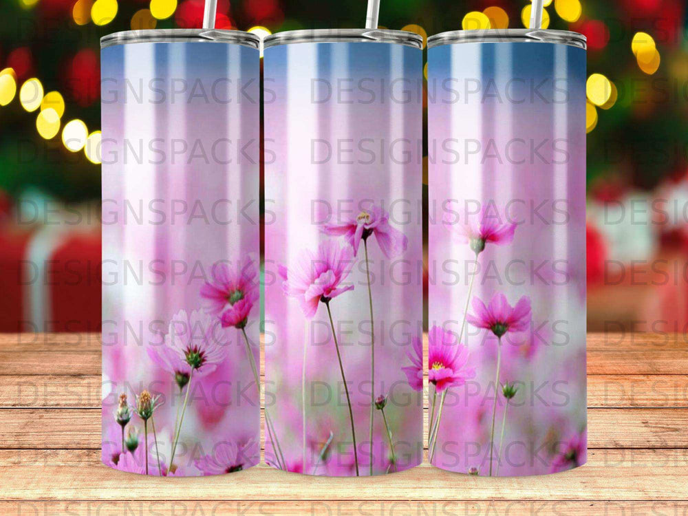 Pink flowers on a tumbler with repeating "DESIGNSPACKS" text.