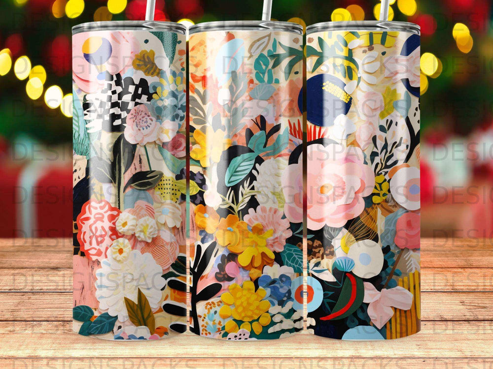 Three tumblers with colorful floral and abstract patterned designs.