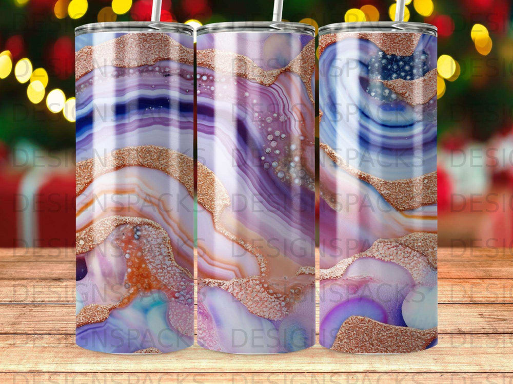 Three tumblers with marbled purple, pink, and gold abstract design.