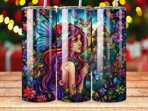 Fantasy art tumbler with a woman with wings, butterflies, and flowers.