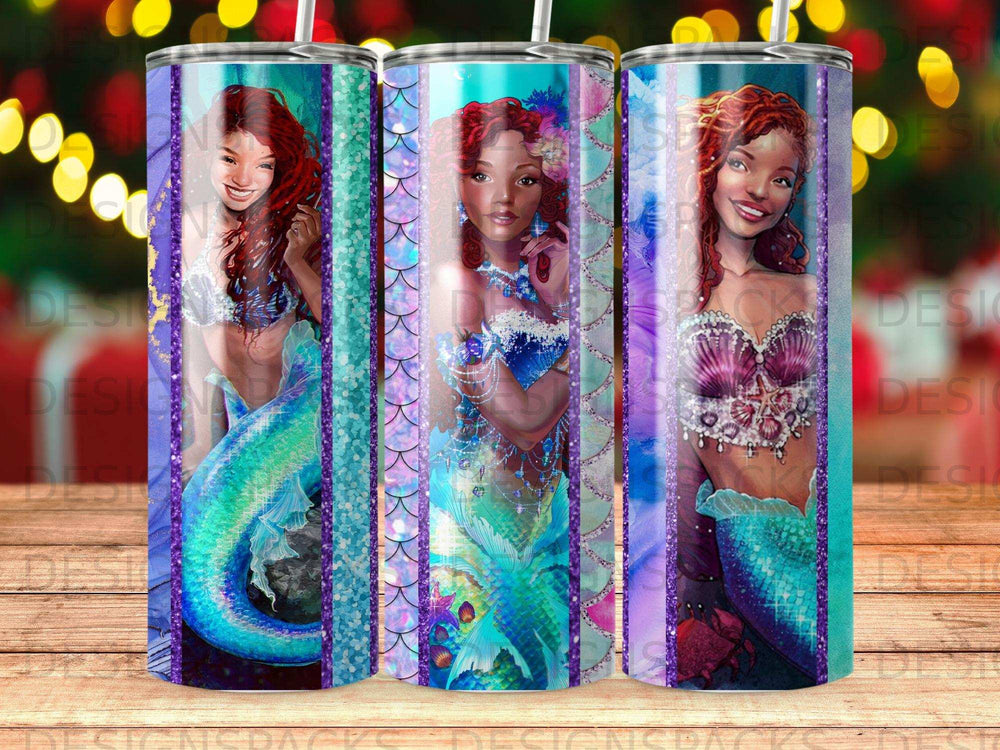 Three tumblers with mermaid designs and colorful scales.