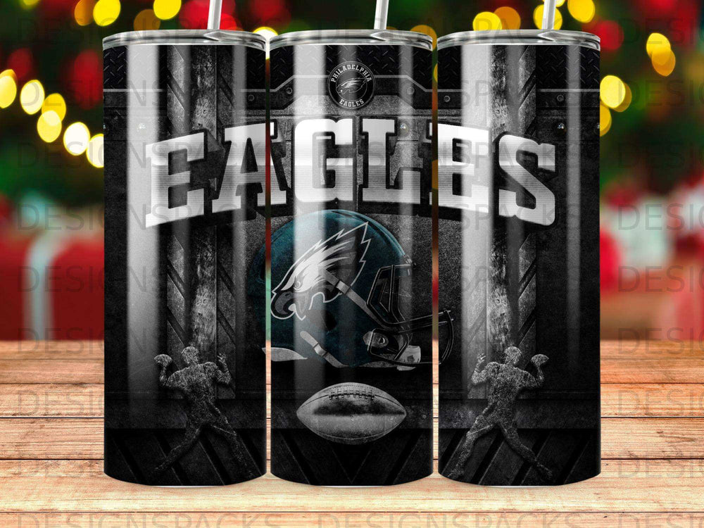 Philadelphia Eagles logo and helmet on a black and white striped tumbler.