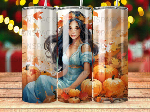Woman in blue dress surrounded by pumpkins and autumn leaves.
