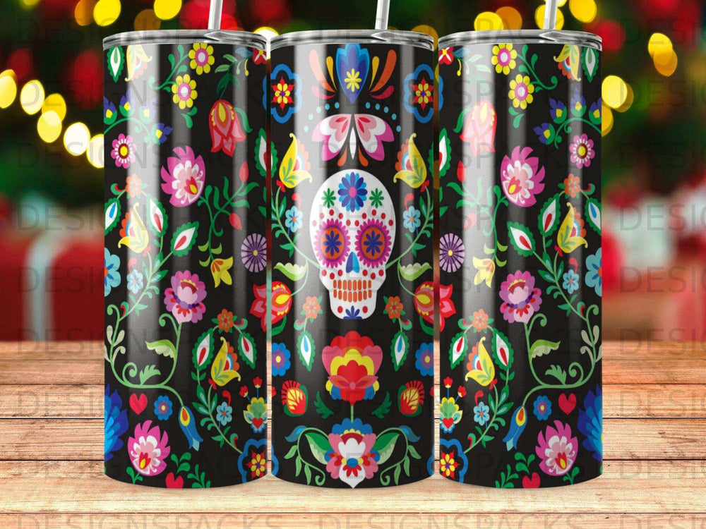 Black tumbler with Day of the Dead floral skull design and colorful folk art.
