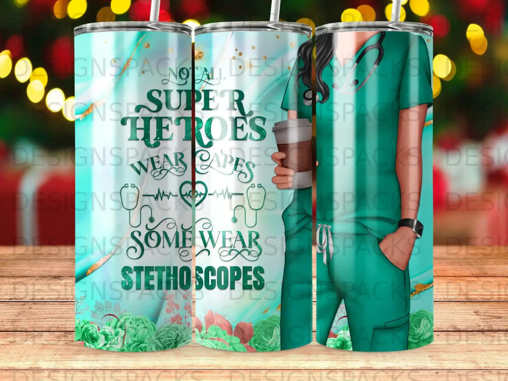 Tumbler with "Super Heroes Wear Stethoscopes" text and teal medical graphic.