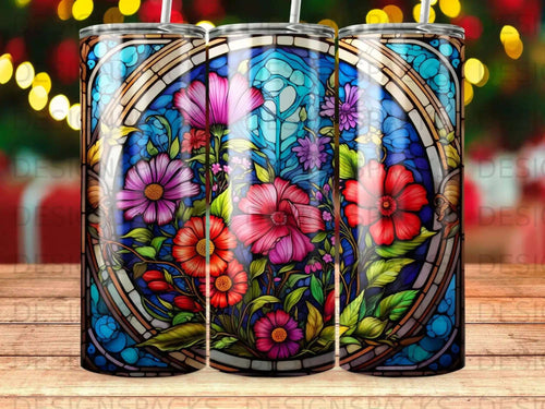 Stained glass tumbler with colorful floral and blue geometric pattern.