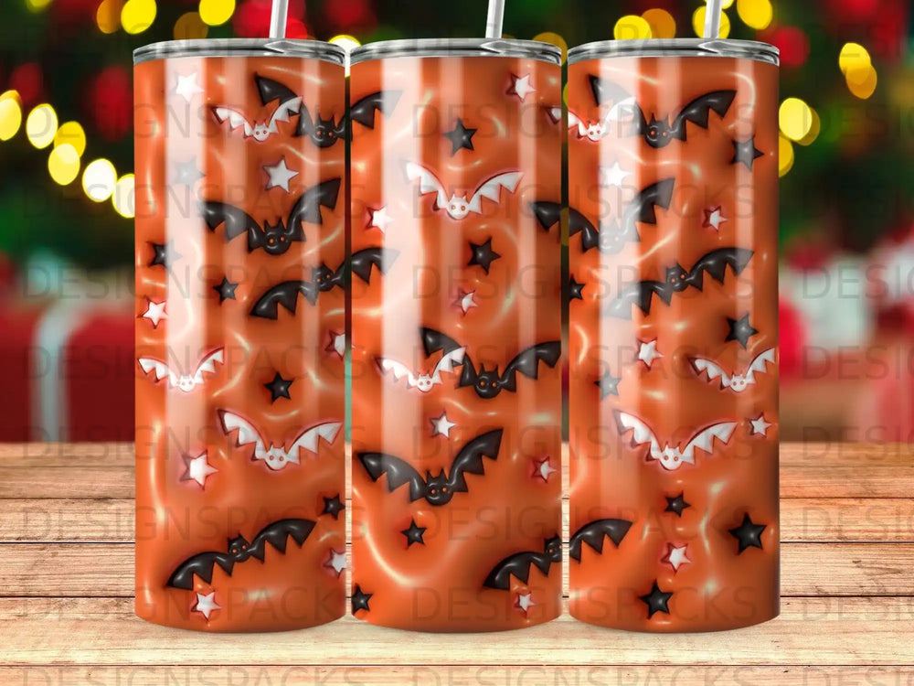 Orange tumbler with bats, stars, and spooky eyes pattern.
