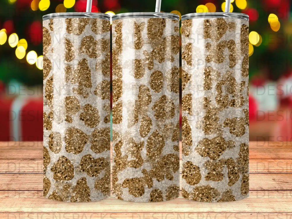 Tumbler with a gold and white leopard print pattern.