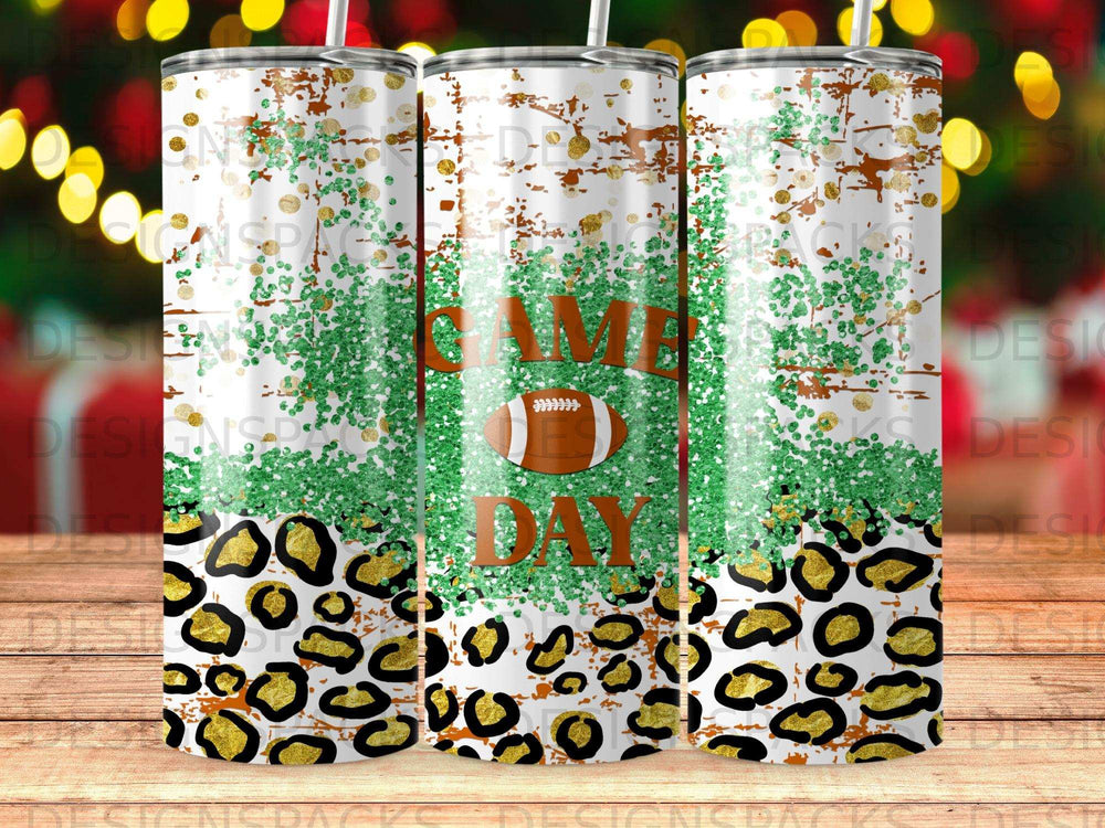 Tumbler with "Game Day" text, football, green glitter, and leopard print.