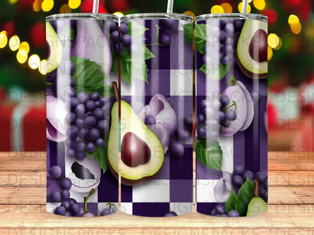 Tumbler with purple grapes and avocado slices on a checkered background.