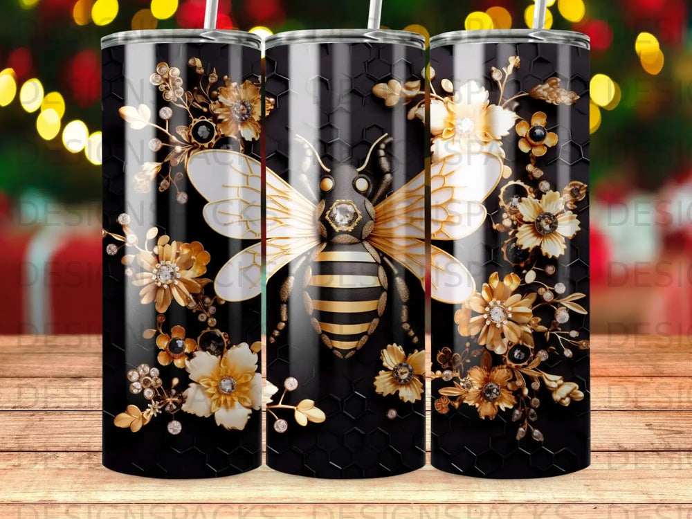 Black tumbler with a gold bee and floral honeycomb pattern.