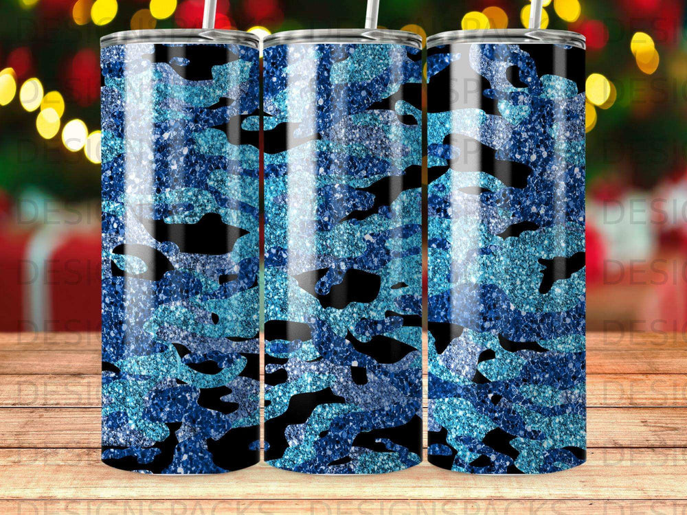 Blue glitter camouflage tumbler with blurred festive lights background.