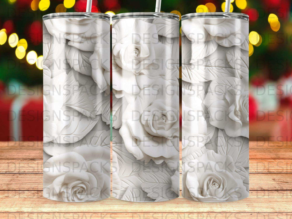 White rose floral pattern on three blank sublimation tumblers.