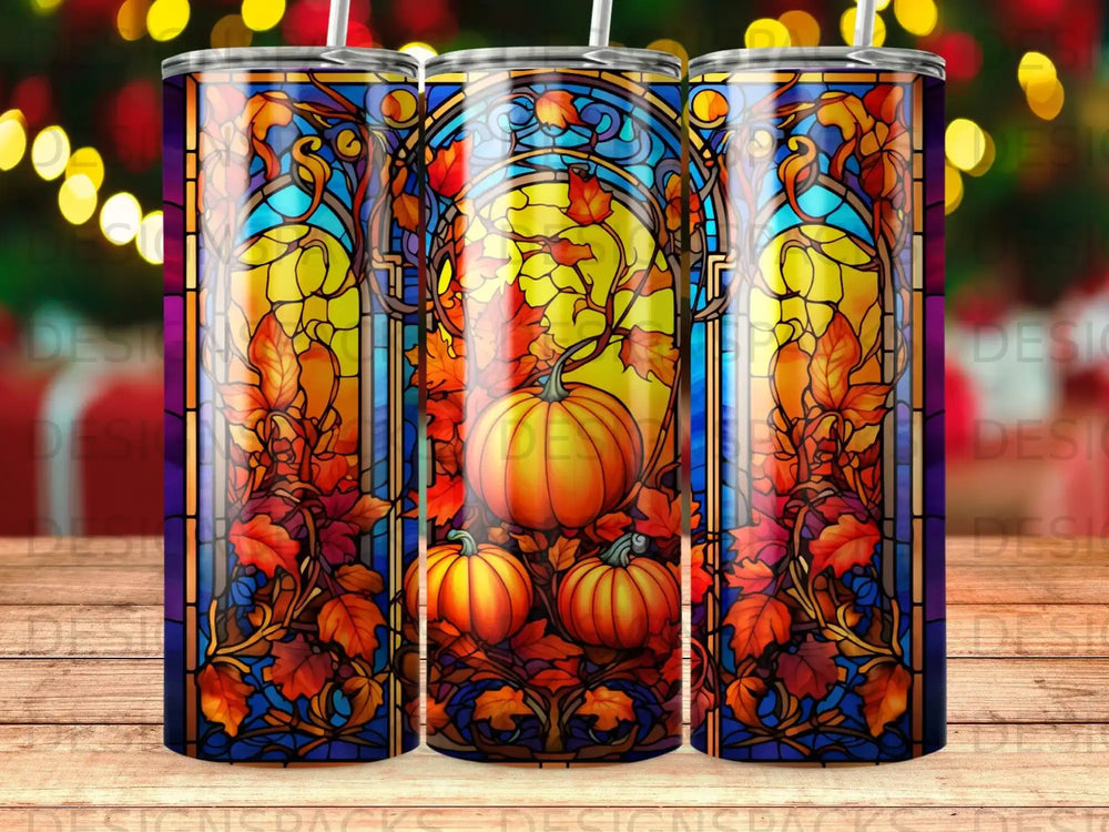 Stained glass pattern with pumpkins and fall leaves on a tumbler.