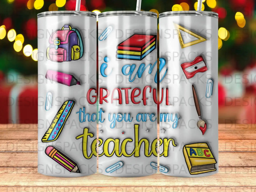 Tumbler with "I am grateful that you are my teacher" text and school supplies.