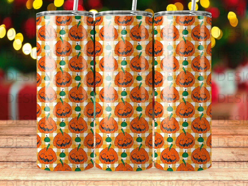 Orange pumpkin plaid pattern tumbler with green stems and carved faces.