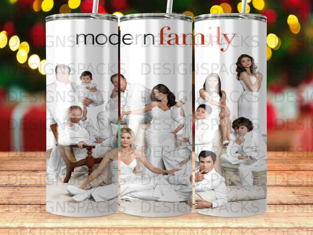 Modern Family cast posing for a group portrait in white attire.
