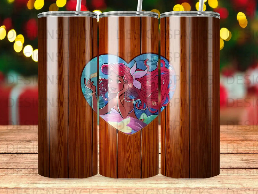 Ariel the mermaid with red hair in a heart shape on a wooden background.