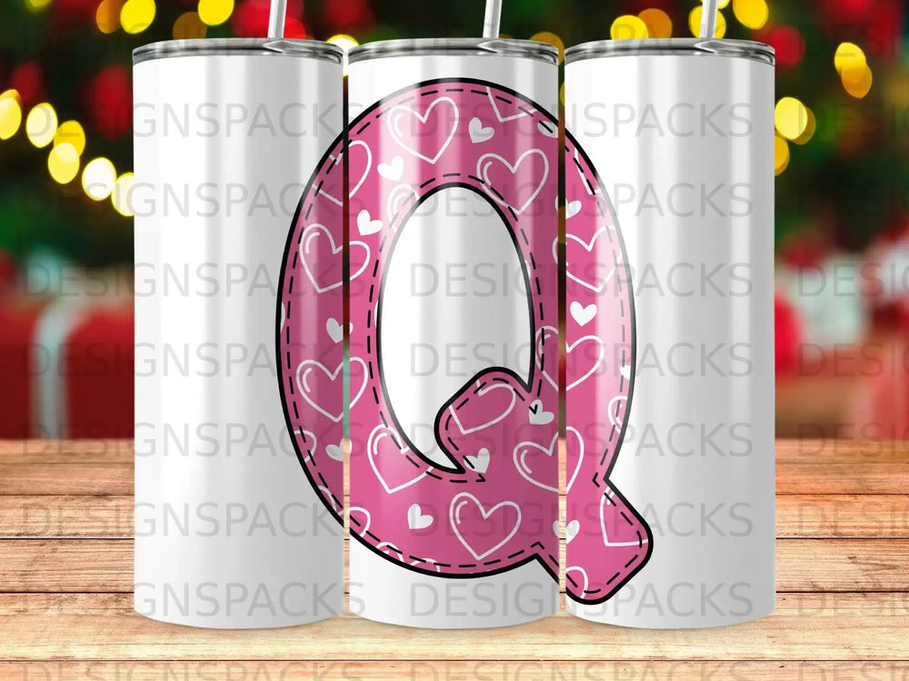 Pink hearts pattern on a white tumbler with a slightly blurred background.