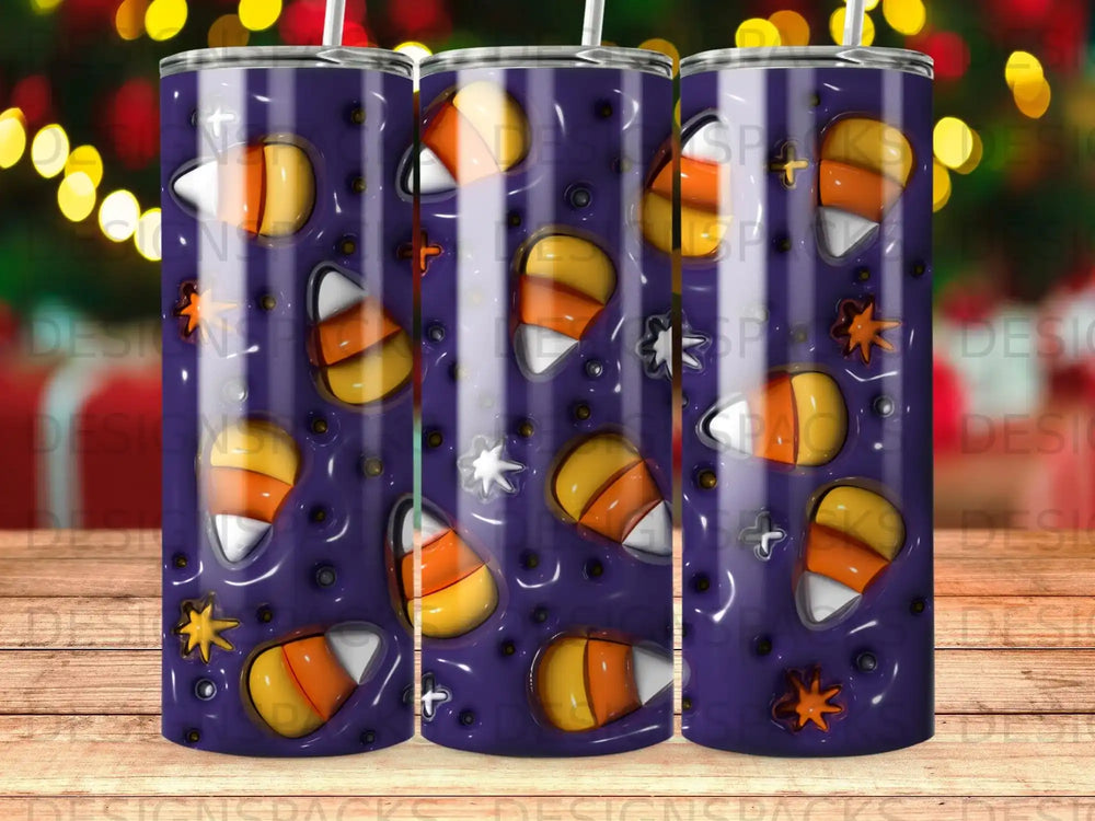 Tumbler with a spooky purple background and candy corn and star pattern.