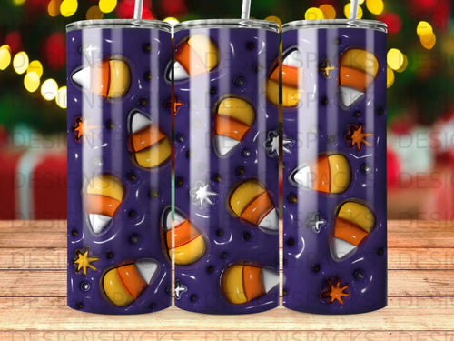 Tumbler with a spooky purple background and candy corn and star pattern.