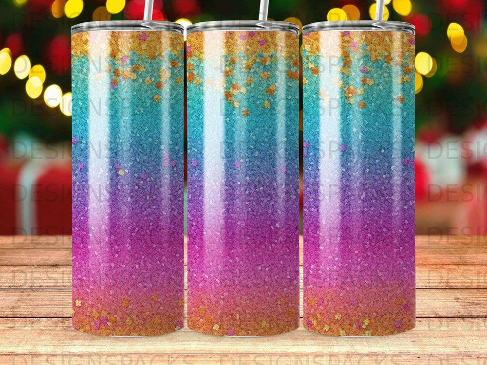 Gradient tumbler with pink, purple, and teal, speckled with gold glitter.