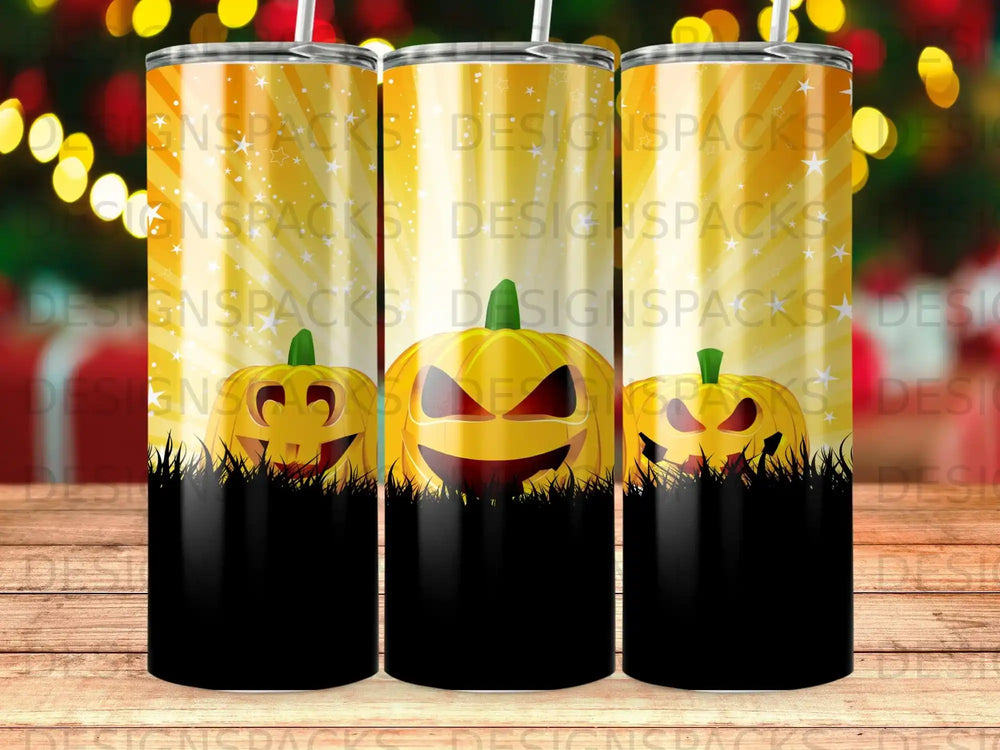 Three Halloween-themed tumblers with jack-o'-lantern faces and festive background patterns.