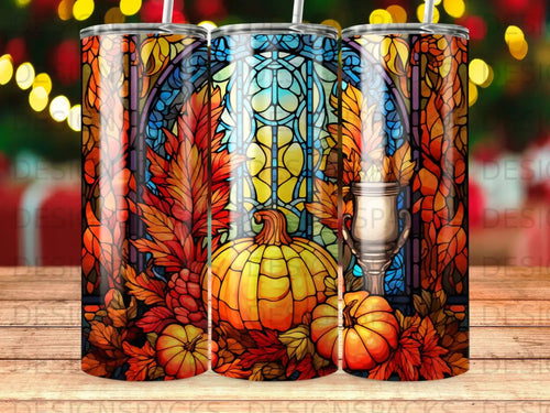 Stained glass design with pumpkins, autumn leaves, and a goblet.