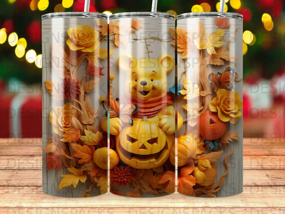 Pumpkin Winnie the Pooh with butterflies and autumn leaves on wood grain tumbler.