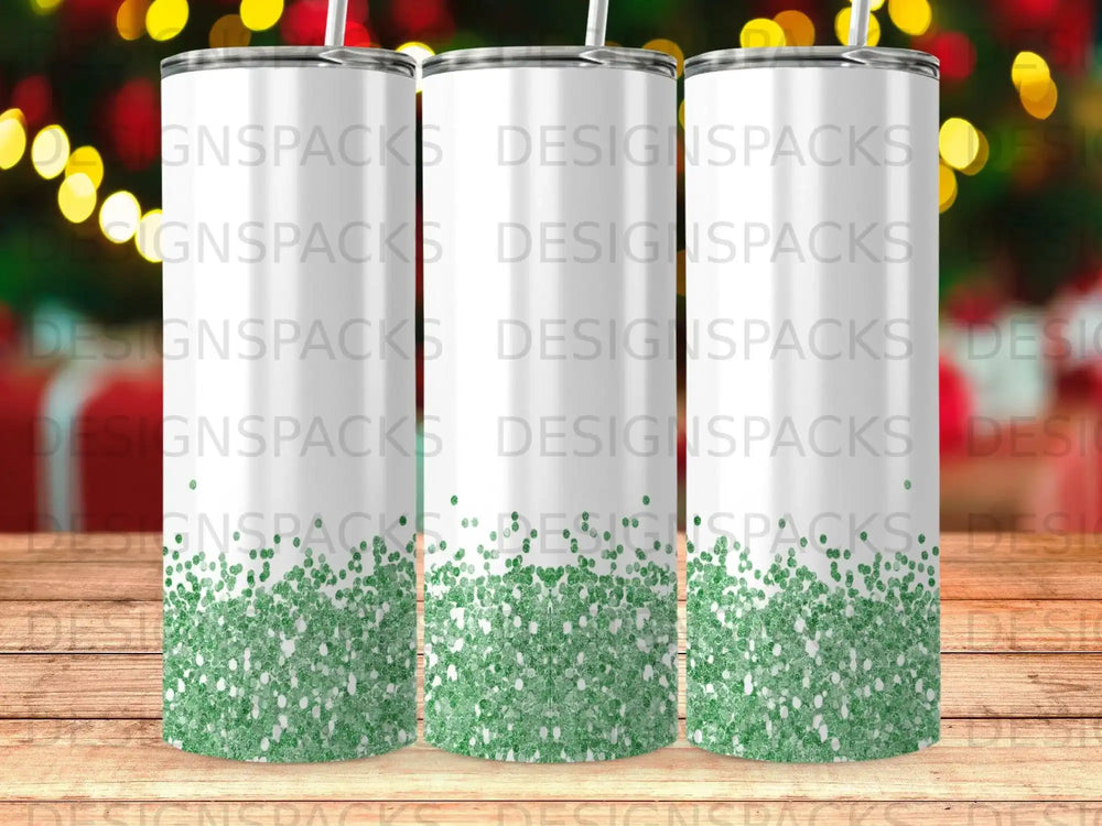 Three tumblers with a green glitter design and "DESIGNS PACKS" watermark.