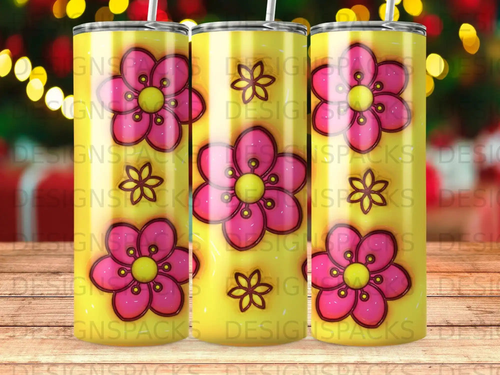 Tumbler with yellow background and repeating pink floral pattern.