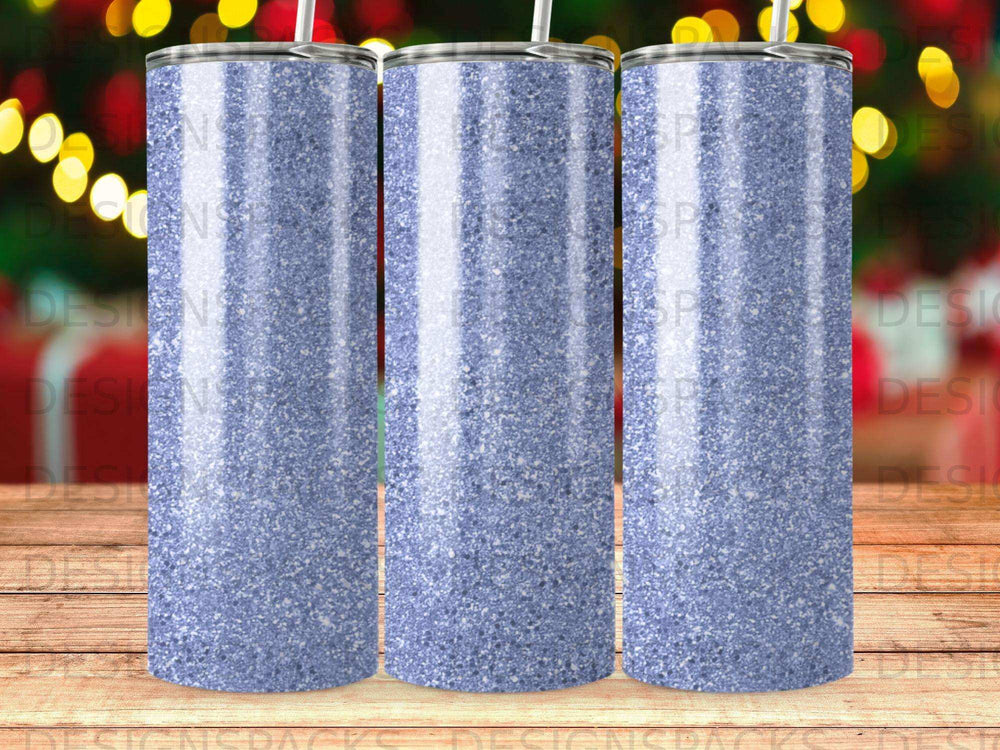 Three glittery blue tumblers with straws in a row.
