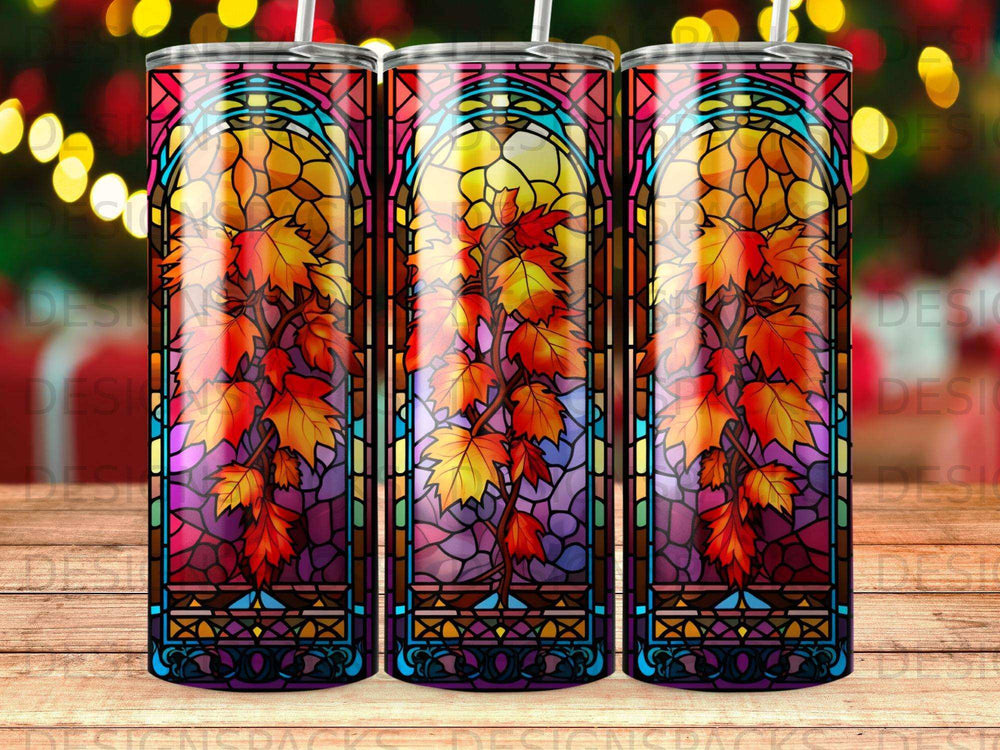 Stained glass tumbler with autumn leaves and floral motifs.