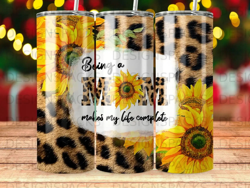 Sunflower and leopard print tumbler with text "Being a mom makes my life complete".