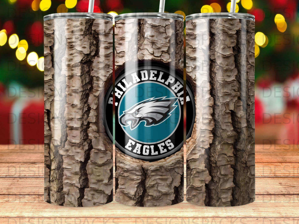 Philadelphia Eagles logo on a textured, bark-like tumbler with bokeh lights.