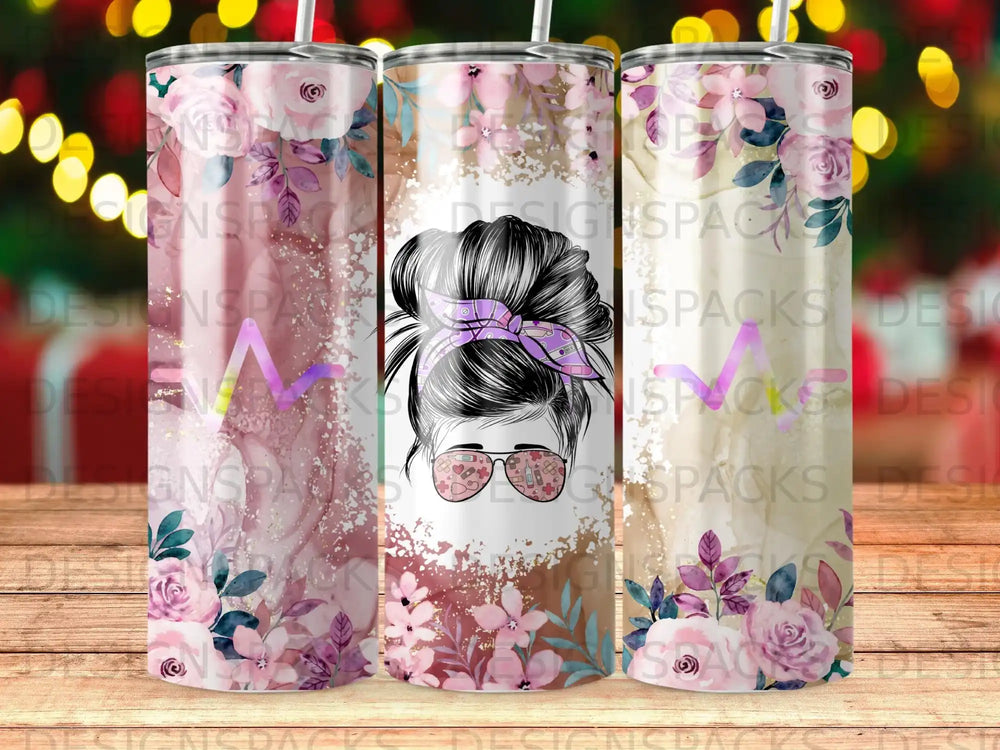Tumbler with a woman's messy bun and floral design.